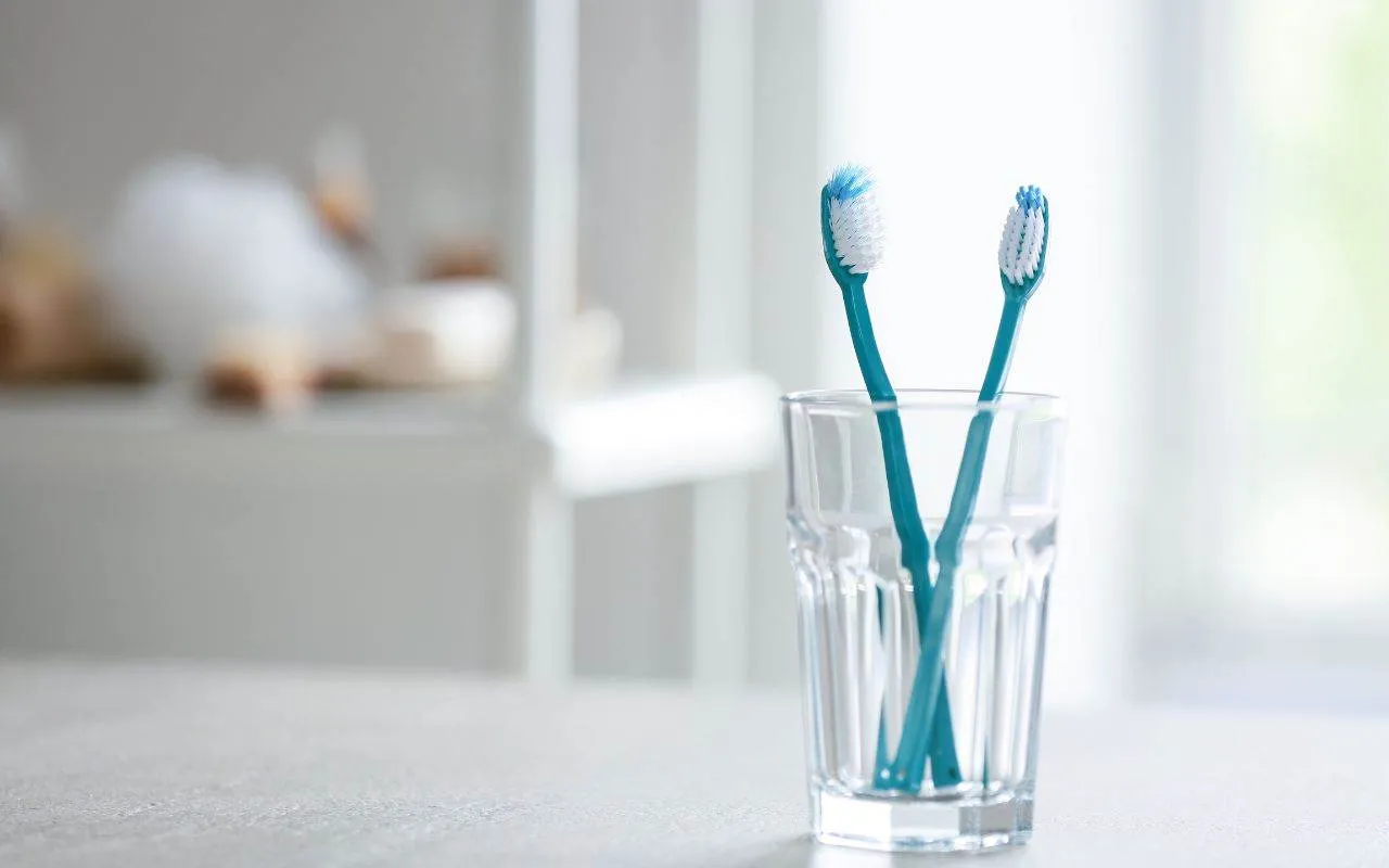 let toothbrush bristles dry completely by storing toothbrushes so they